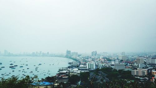 High angle view of buildings in city against sky