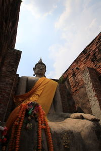 Low angle view of statue against sky