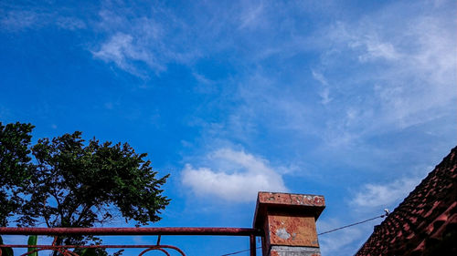 Low angle view of building against blue sky