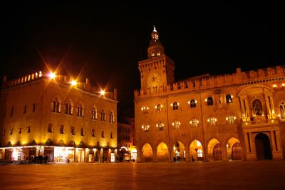 Illuminated buildings in city at night