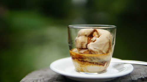 Close-up of ice cream in cup on table