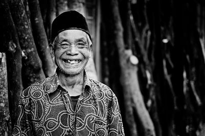 Portrait of smiling man in forest