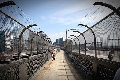 People walking on bridge