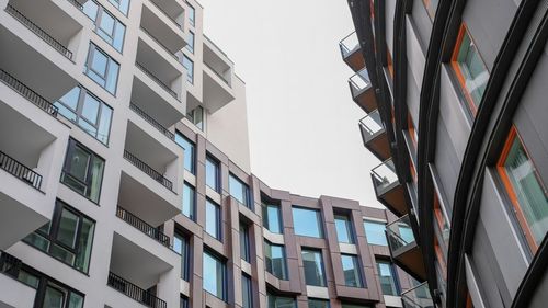 Low angle view of modern buildings against clear sky