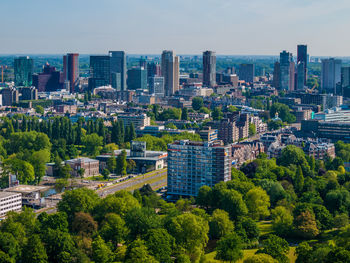 High angle view of trees and buildings against sky