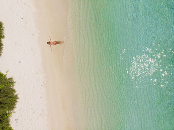 High angle view of woman relaxing at beach