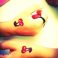 Close-up of hand holding heart shape on table