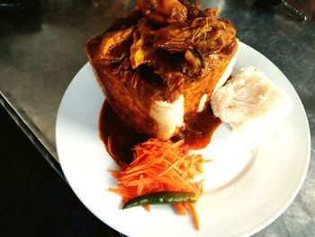 High angle view of meat in plate on table