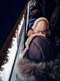 High angle view of people sitting in land vehicle