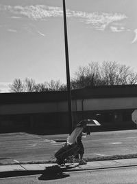 Boy on road against trees