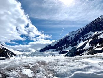 Scenic view of snowcapped mountains against sky