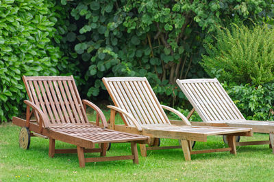 Empty wooden relax lounger in a garden