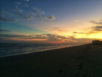 Scenic view of beach against sky during sunset