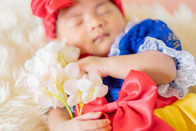 Portrait of cute girl with bouquet