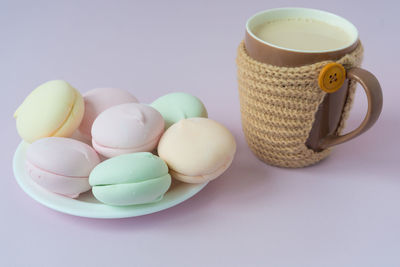 Close-up of multi colored coffee cup on table