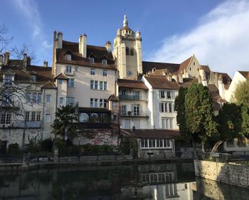 The notre-dame de dole church and the old town seen from the canal des tanneurs historical landmark