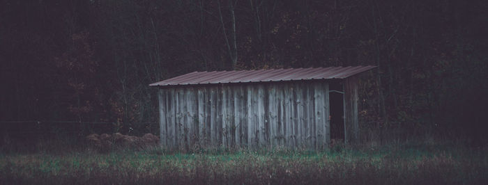 Abandoned barn on field