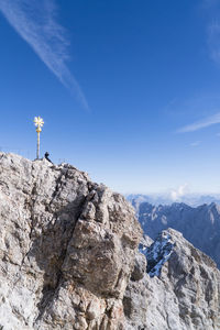 Scenic view of mountains against blue sky