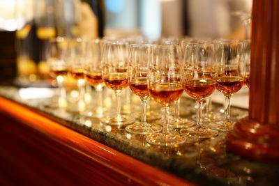 Close-up of wine glasses on table