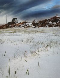 Scenic view of frozen lake against sky during winter