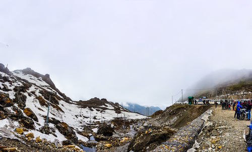 Scenic view of mountains against sky during winter