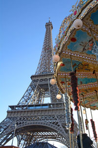 Low angle view of ferris wheel against sky