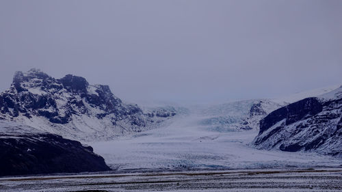 Scenic view of snowcapped mountain against sky