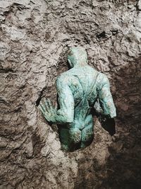 High angle view of statue on rock