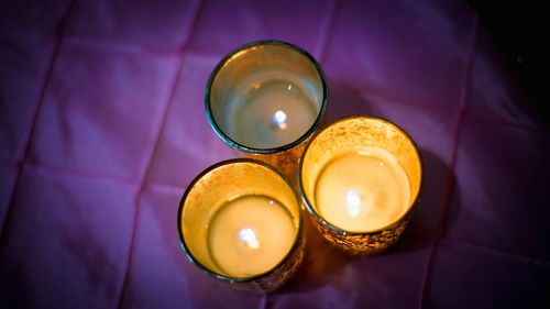 High angle view of illuminated tea light candle