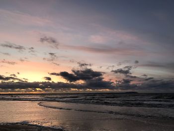 Scenic view of sea against sky at sunset