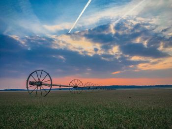 Scenic view of field against sky during sunset