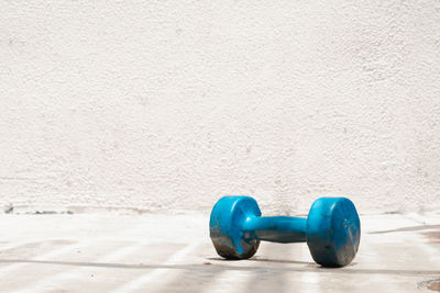 Close-up of dumbbells on floor