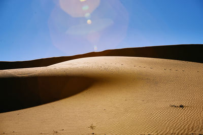 Scenic view of desert against clear sky