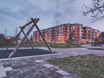 Footpath by building against sky