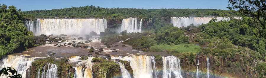 Panoramic view of waterfall in forest