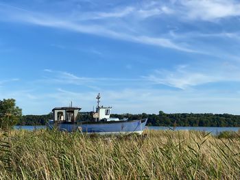 Fishing boat. scenic view of sea against sky