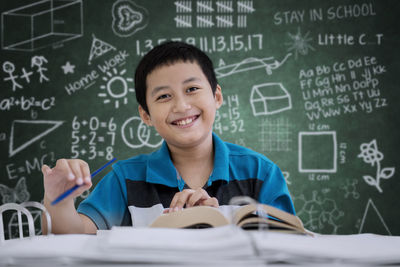 Boy studying at table