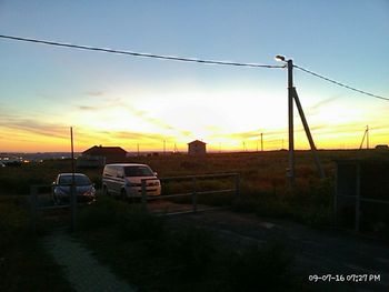 Car against sky at sunset