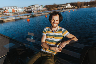 Portrait of smiling man on boat in water