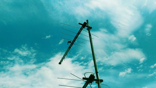 Low angle view of electricity pylon against sky