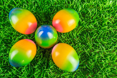 Close-up of colorful eggs in grass