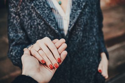 Close-up of woman holding hands