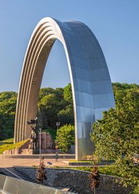 Arch of friendship of nations in kyiv, ukraine, on a sunny summer morning