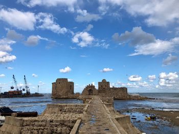 Scenic view of sea against cloudy sky