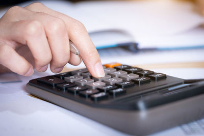 Close-up of person hand on table