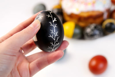 Easter black egg with tree ornament. easter cake craffin. close up easter eggs pastel colored 