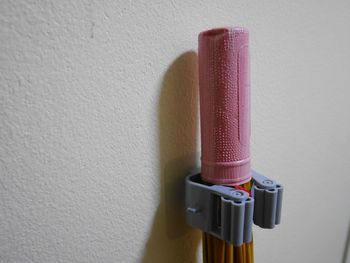 Close-up of colored pencils on wall