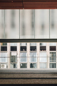 Reflection of building on glass window