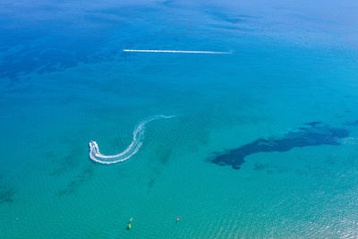 High angle view of bubbles on sea shore