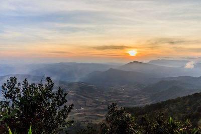 Scenic view of mountains against sky during sunset